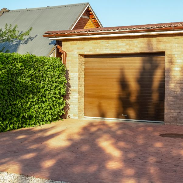 brown garage doors of a residential house lansing mi